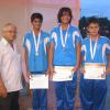 Mr. N. Macnamara, Principal of St. Joseph's College with the winners of one of the girls events